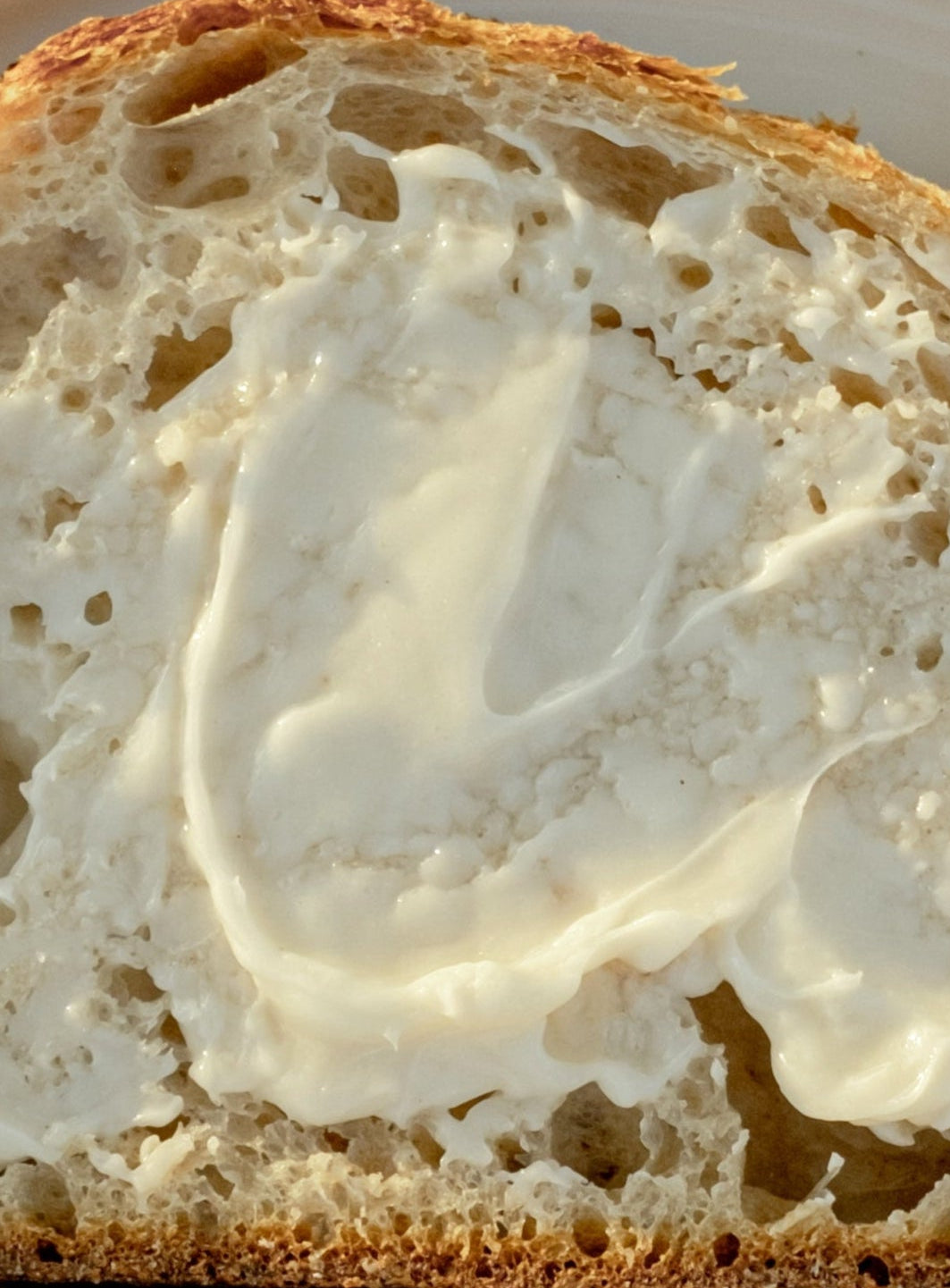 delicious melty butter on whole grain bread