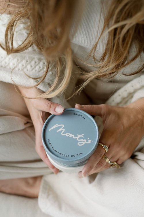 Lauren holding a cup of Monty's Original Butter