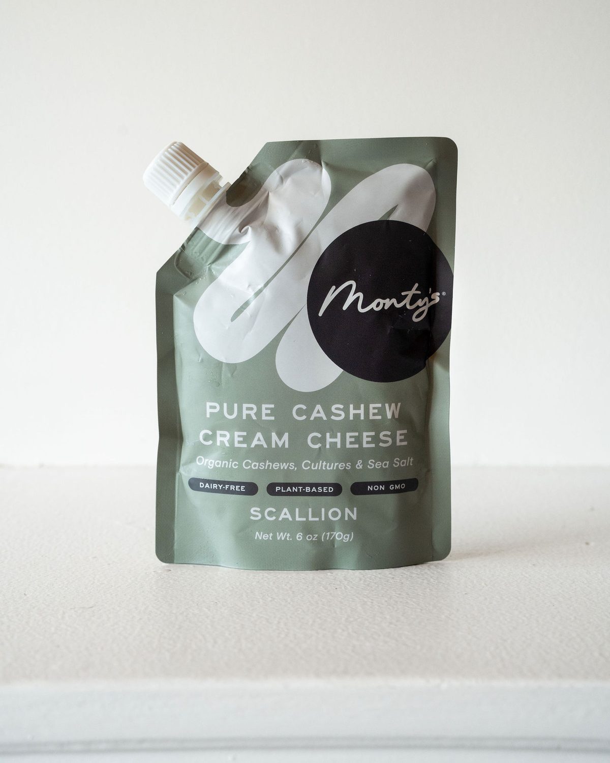A pouch of Monty's Pure Cashew Cream Cheese, Scallion