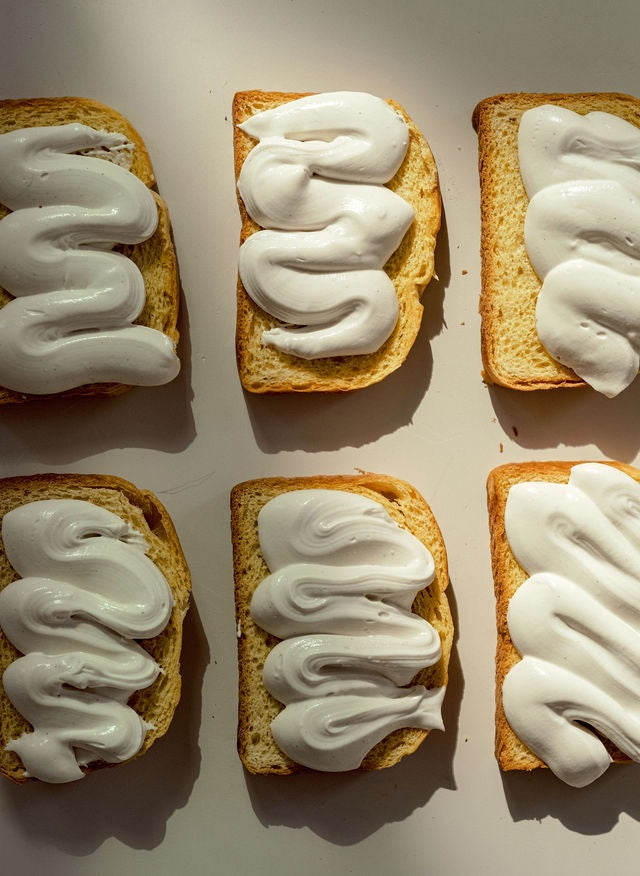 Six slices of brioche toast with thick swirls of Monty's cream cheese